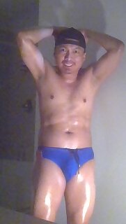 Oiled up, flexing and posing while wearing Speedos!!!